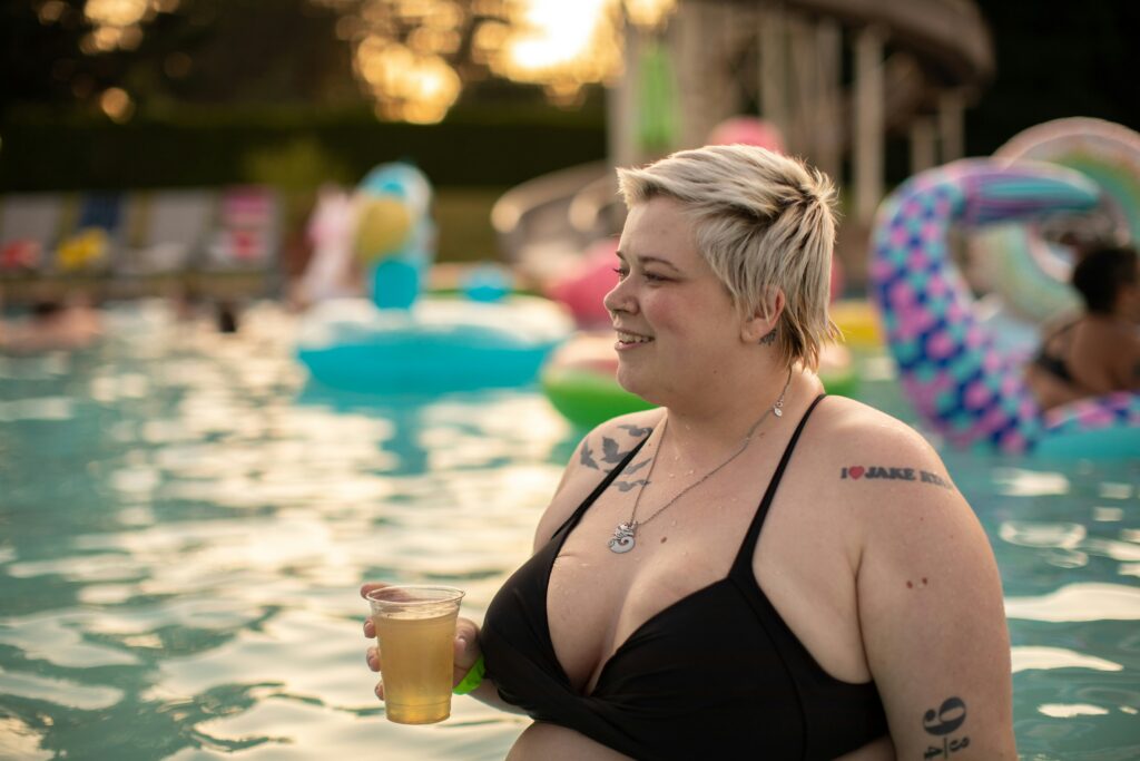 Tattooed woman in pool